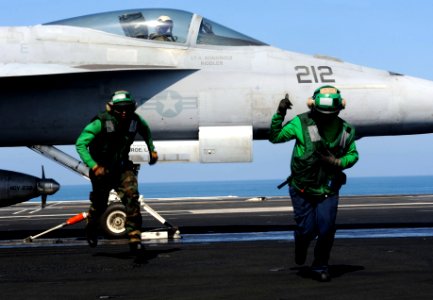 US Navy 111024-N-OY799-214 Aviation Boatswain's Mate (Equipment) 3rd Class Gabriel Garcia and Aviation Boatswain's Mate (Equipment) 3rd Class Luong