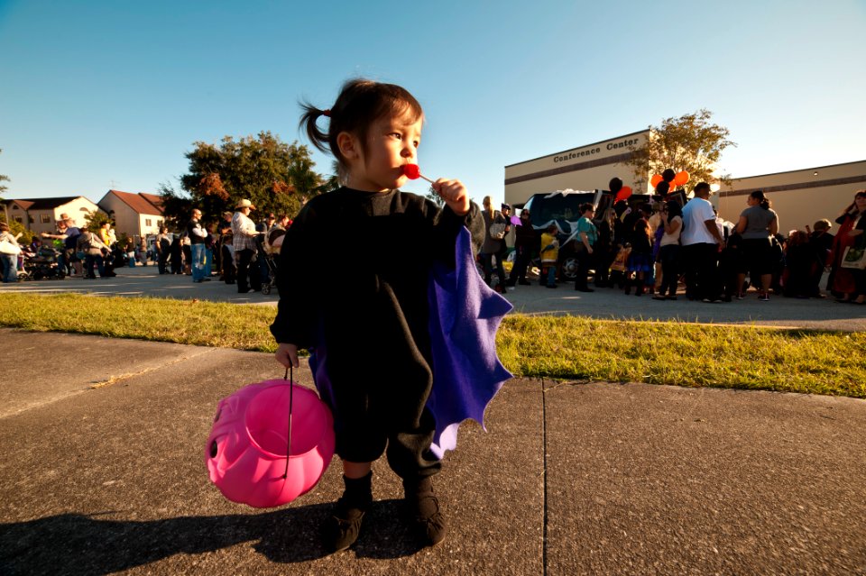 US Navy 111022-N-FG395-244 A child eats her candy after taking part in a Trunk or Treat event at Naval Submarine Base Kings Bay. More than 1,000 co