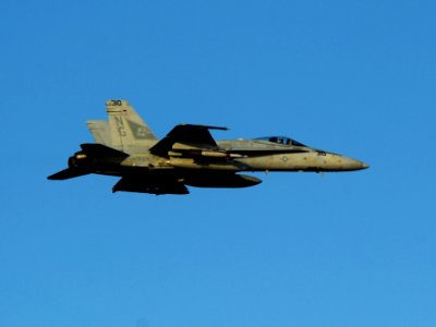 US Navy 111024-N-OY799-722 An F-A-18C Hornet assigned to the Warhawks of Strike Fighter Squadron (VFA) 97 flies over of the Nimitz-class aircraft c