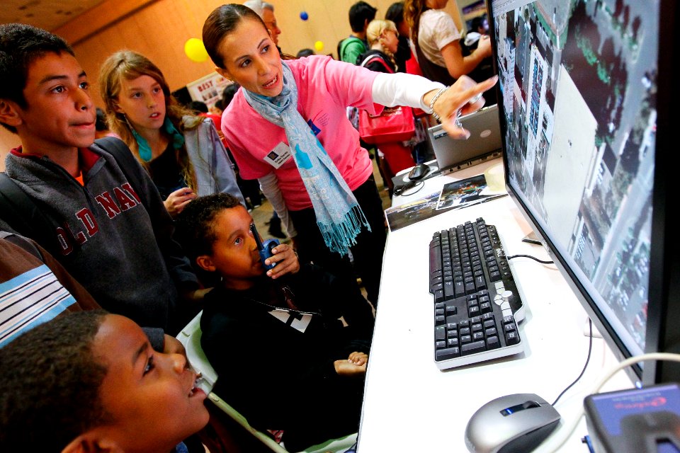 US Navy 111025-N-HW977-601 Naval Surface Warfare Center Corona Division engineer Erika Garcia, right, directs students in the use of ground trackin