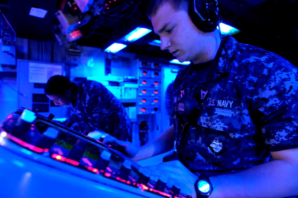 US Navy 111025-N-WJ771-007 Operations Specialist Seaman Recruit Alexander D. Rumpf monitors a radar console in the combat information center of the