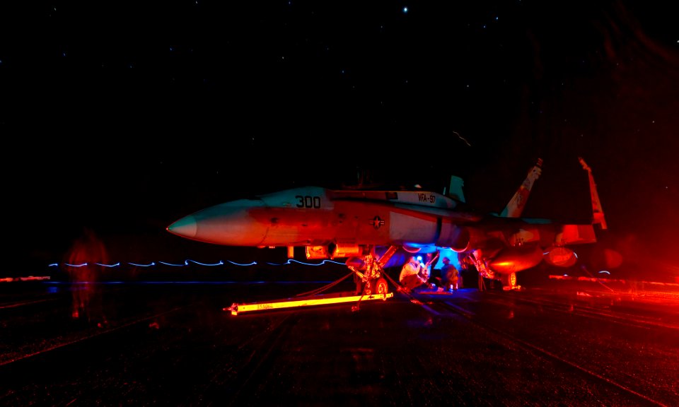 US Navy 111025-N-GC412-086 Sailors perform maintenance on an F-A-18C Hornet assigned to the Warhawks of Strike Fighter Squadron (VFA) 97 aboard the
