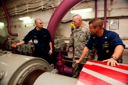 US Navy 111026-N-BT887-490 Command Sgt. Maj. Frank A. Grippe, the senior enlisted leader at U.S. Central Command, tours one of the drive shafts abo