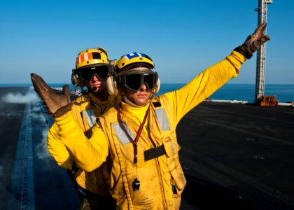 US Navy 111025-N-BT887-095 Sailors direct aircraft on the flight deck of the aircraft carrier USS John C. Stennis (CVN 74)