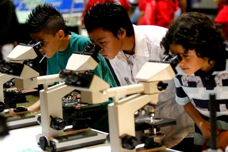 US Navy 111025-N-HW977-834 Students from Mira Loma and Loma Vista Middle School look into microscopes