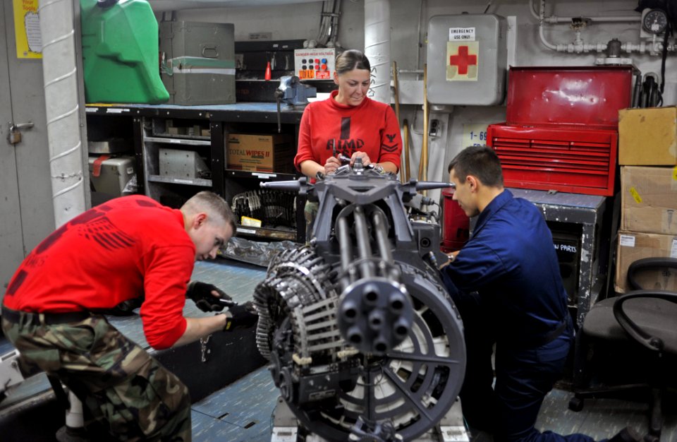 US Navy 111025-N-SF704-259 Sailors work on an M61A-2 Vulcan 20 mm Gatling gun
