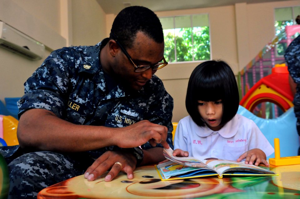 US Navy 111025-N-WW409-198 Chief Intelligence Specialist Jayson Fuller, assigned to the guided-missile destroyer USS Mustin (DDG 89), reads a book