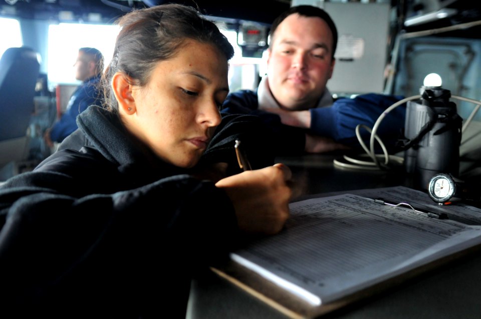 US Navy 111107-N-WW409-022 Personnel Specialist 2nd Class Blanca Marin stands watch on the bridge of the guided-missile destroyer USS Mustin