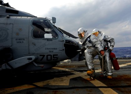 US Navy 111026-N-VH839-016 Sailors assigned to the guided-missile destroyer USS Wayne E. Meyer (DDG 108) perform overhaul procedures on an MH-60R h photo