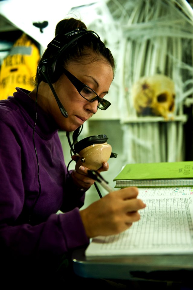 US Navy 111029-N-BT887-171 Aviation Boatswain's Mate (Fuel) Airman Jessica Matos, from Scotia, N.Y., logs aircraft refueling in flight deck control