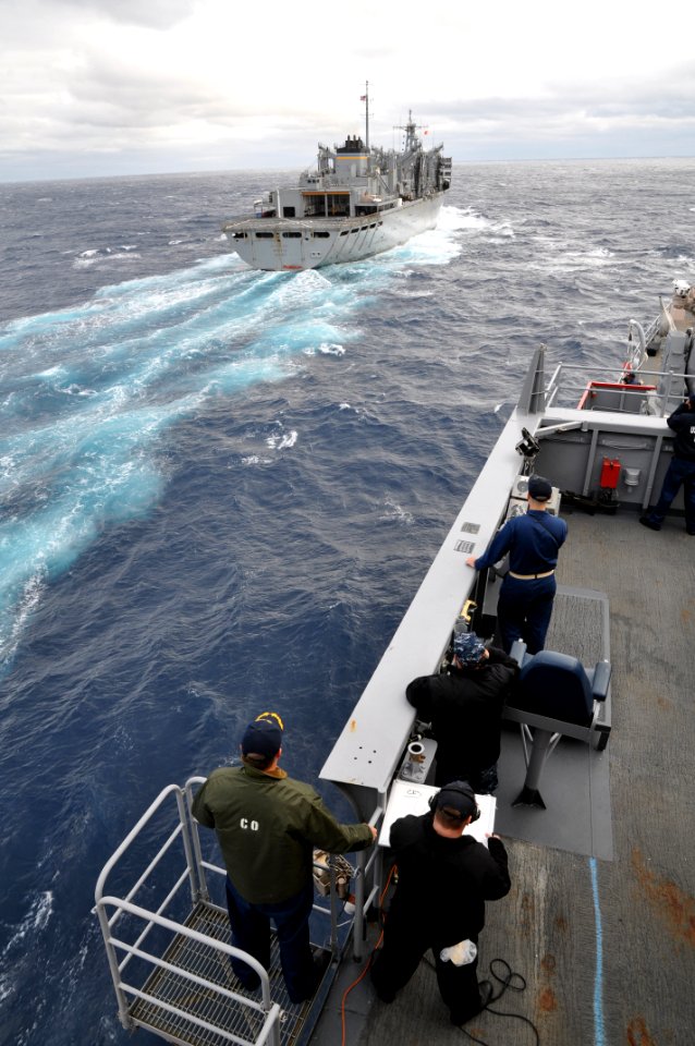 US Navy 111029-N-YX169-283 Cmdr. Cole Hayes, left, commanding officer of the amphibious transport dock ship USS Ponce (LPD 15), and Sailors aboard