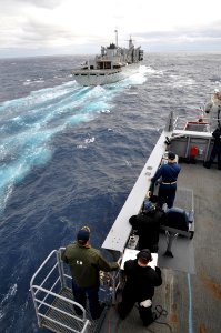 US Navy 111029-N-YX169-283 Cmdr. Cole Hayes, left, commanding officer of the amphibious transport dock ship USS Ponce (LPD 15), and Sailors aboard