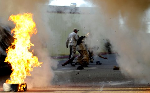 US Navy 111028-N-UB993-027 Sailors react to a simulated improvised explosive device during a training exercise as part of the Tactical Combat Casua