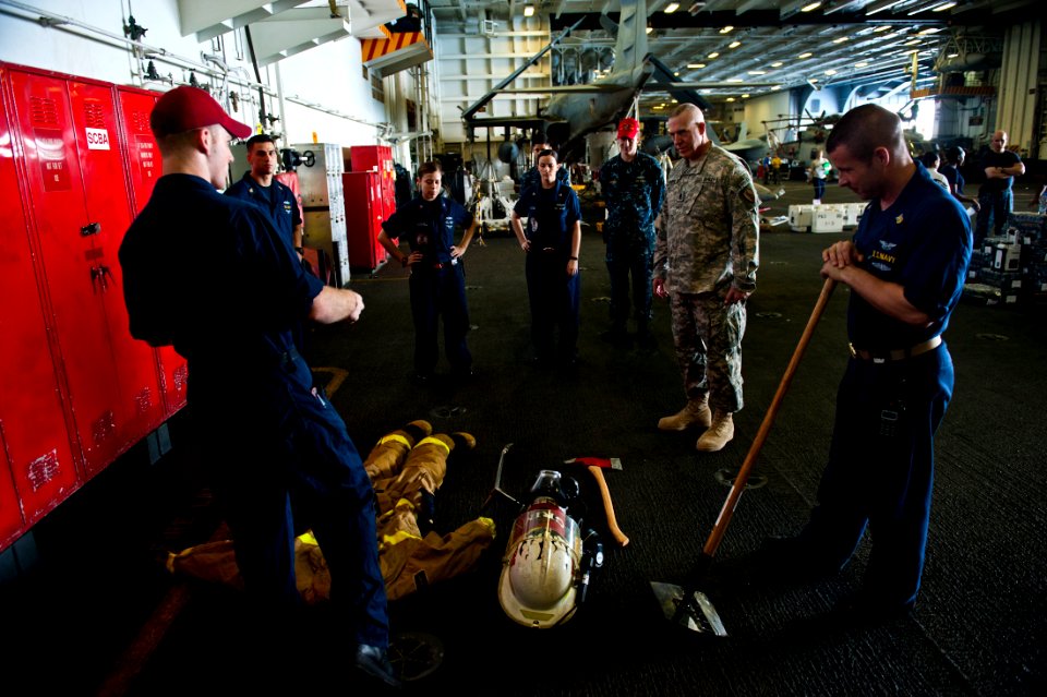 US Navy 111027-N-BT887-339 Command Sgt. Maj. Frank A. Grippe, the senior enlisted leader at U.S. Central Command, examines firefighting equipment d