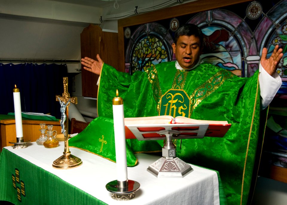 US Navy 111026-N-RJ456-003 Lt. Jose Bautistarojas conducts Roman Catholic Mass in the chapel aboard the Nimitz-class aircraft carrier USS John C. S