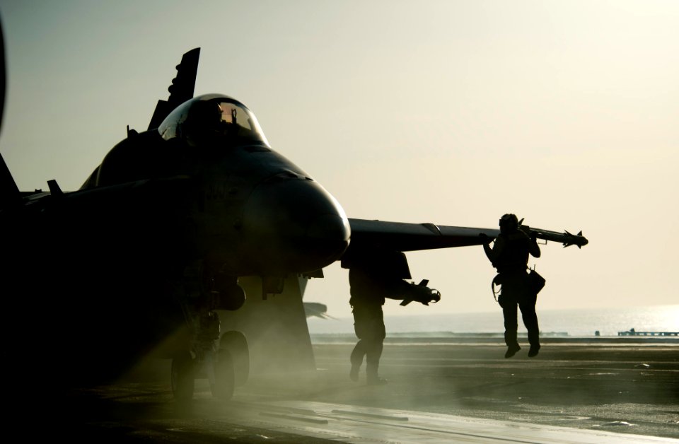 US Navy 111029-N-VN693-716 Sailors perform final checks before launching an F-A-18C Hornet from the Warhawks of Strike Fighter Squadron (VFA) 97 fr