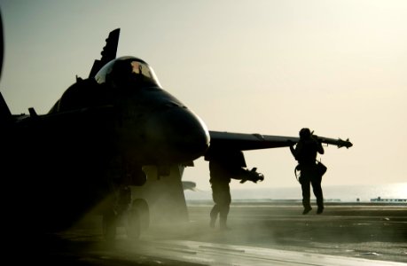 US Navy 111029-N-VN693-716 Sailors perform final checks before launching an F-A-18C Hornet from the Warhawks of Strike Fighter Squadron (VFA) 97 fr