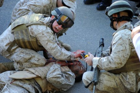 US Navy 111028-N-MN220-366 Hospital corpsmen participating in the Tactical Combat Casualty Course at Naval Medical Center San Diego (NMCSD) treat c photo