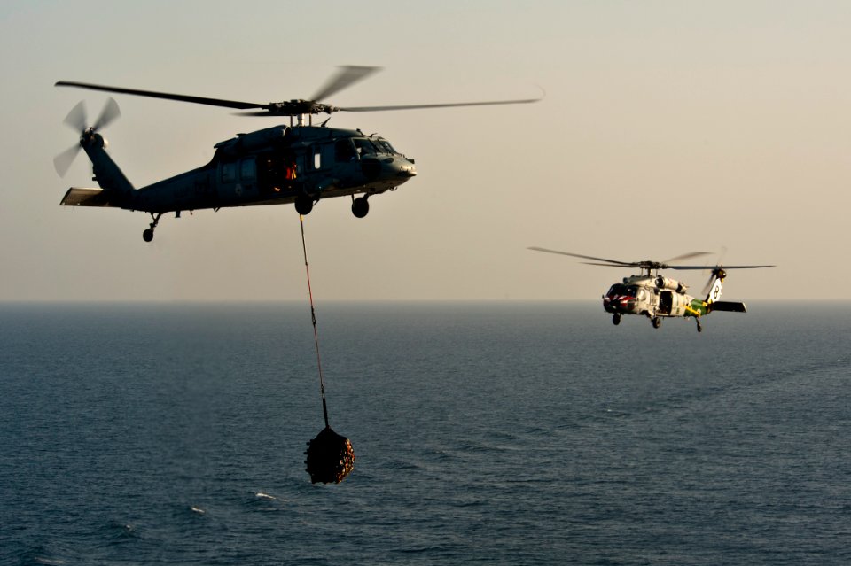 US Navy 111027-N-BT887-085 MH-60S Sea Hawk helicopters assigned to the Eightballers of Helicopter Sea Combat Squadron (HSC) 8 transfer cargo