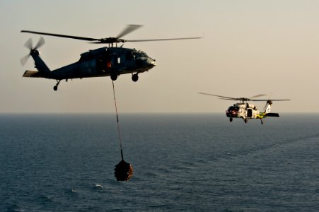 US Navy 111027-N-BT887-085 MH-60S Sea Hawk helicopters assigned to the Eightballers of Helicopter Sea Combat Squadron (HSC) 8 transfer cargo