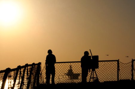 US Navy 111029-N-XQ375-442 Logistics Specialist Seaman Kenneth Butts, left, and Logistics Specialist 2nd Class Nelson Felix observe the multipurpos