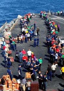 US Navy 111102-N-QL471-013 Sailors line up for food during a steel beach cookout aboard USS George H.W. Bush