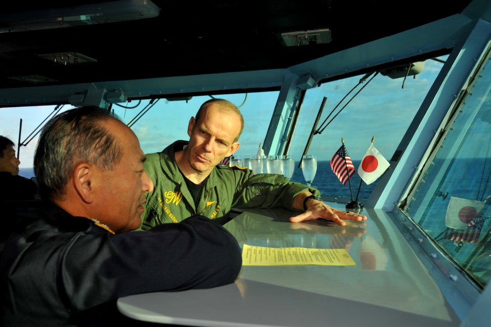 US Navy 111031-N-SF704-483 Rear Adm. John Haley discusses Annual Exercise (ANNUALEX) 2011 with Vice Adm. Katsutoshi Kawano