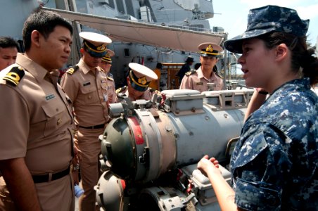 US Navy 111101-N-EA192-051 Gunner's Mate 3rd Class Katherine Curtis explains how the ship's torpedo launcher works