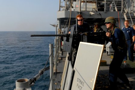 US Navy 111028-N-DU438-024 Gunner's Mate Seaman Eric Wheeler fires an M240 machine gun during a gunnery exercise aboard guided-missile cruiser USS
