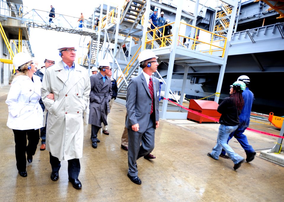 US Navy 111028-N-ER745-101 Members of U.S. Congress' Armed Services Committee walk pierside along the aircraft carrier USS Theodore Roosevelt (CVN