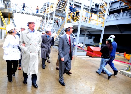 US Navy 111028-N-ER745-101 Members of U.S. Congress' Armed Services Committee walk pierside along the aircraft carrier USS Theodore Roosevelt (CVN