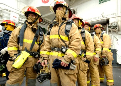 US Navy 111102-N-NR955-019 Sailors of the repair locker firefighting team aboard the Amphibious assault ship USS Iwo Jima watch as another team con
