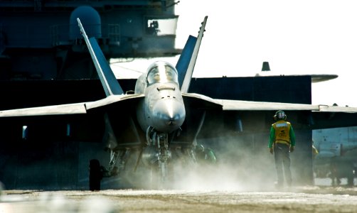 US Navy 111029-N-VN693-079 Sailors prepare to launch an F-A-18E Super Hornet from the Tophatters of Strike Fighter Squadron (VFA) 14 aboard the Nim