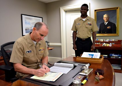 US Navy 111031-N-FC670-004 Chief of Naval Operations (CNO) Adm. Jonathan Greenert reads the Combined Federal Campaign (CFC) pamphlet