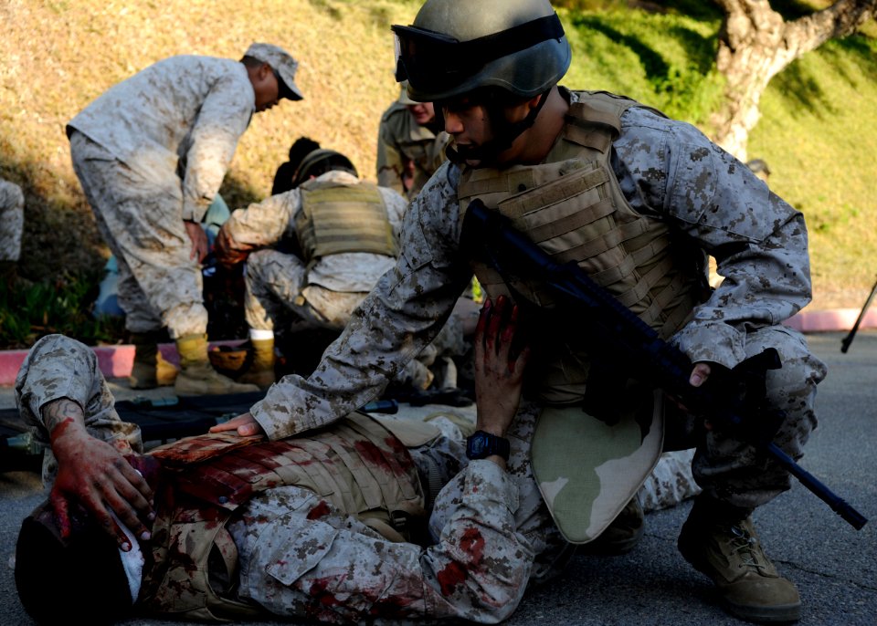 US Navy 111028-N-UB993-070 Hospital corpsmen participating in the Tactical Combat Casualty Course at Naval Medical Center San Diego (NMCSD) treat c