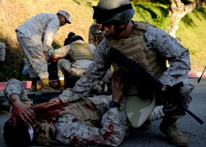 US Navy 111028-N-UB993-070 Hospital corpsmen participating in the Tactical Combat Casualty Course at Naval Medical Center San Diego (NMCSD) treat c photo