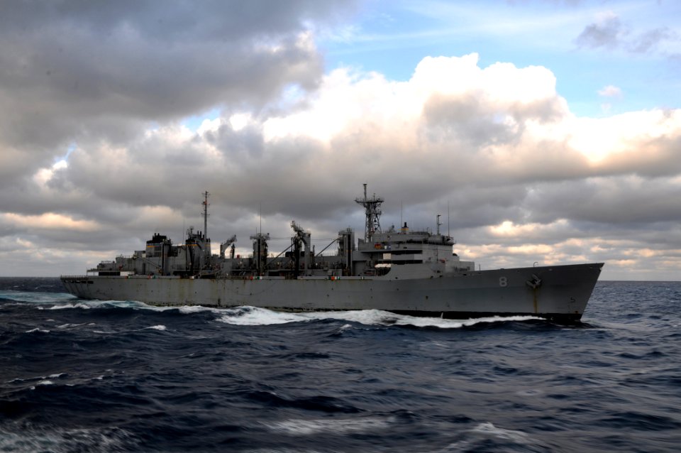US Navy 111029-N-YX169-419 The Military Sealift Command fast combat support ship USNS Arctic (T-AOE 8) maneuvers away from the amphibious transport