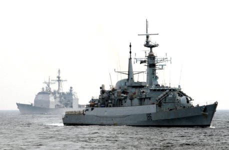 US Navy 111102-N-XQ375-444 The Pakistani navy destroyer PNS Shahjahan (D 186), right, and guided-missile cruiser USS Mobile Bay (CG 53) transit the
