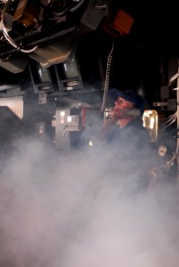 US Navy 111101-N-DU438-099 Quartermaster 2nd Class Victoria Hobgood passes communications from the pilothouse during a fire drill aboard the guided