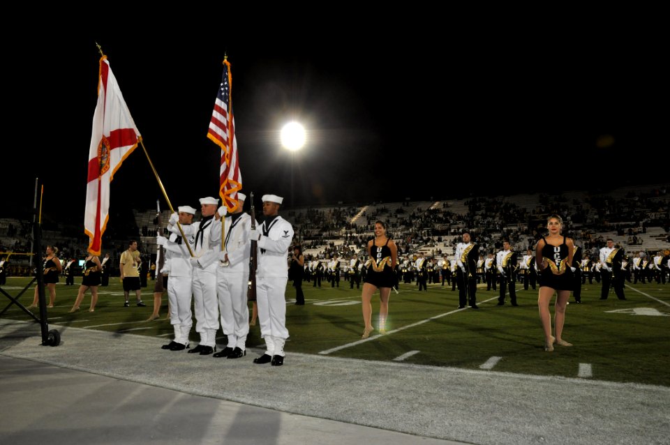 US Navy 111103-N-YX169-297 Electronics Technician 2nd Class Gerald Correanunez, left, Seamen Myles Stratton and Andrew Myers, and Culinary Speciali