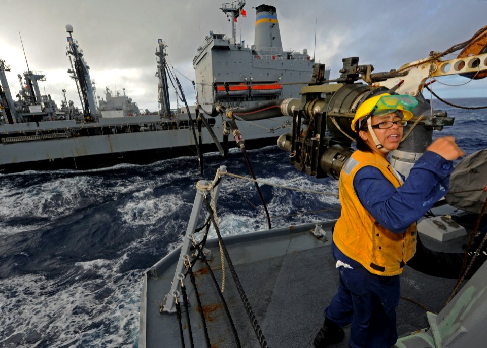 US Navy 111101-N-VH839-061 Boatswain's Mate 3rd Class Candace Worthan mans the underway replenishment fueling station aboard the Arleigh Burke-clas