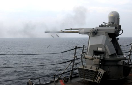 US Navy 111101-N-XQ375-396 A MK-38 25mm machine gun fires during a weapons exercise aboard the guided-missile destroyer USS Mitscher (DDG 57)