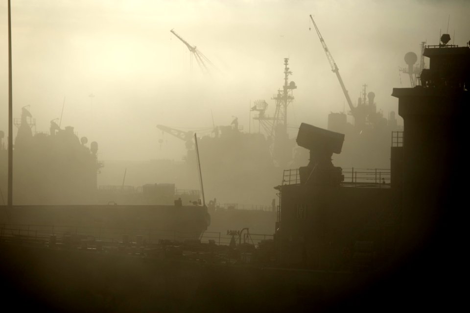 US Navy 111103-N-ZC343-167 Ships moored at Naval Base San Diego are obscured by an early morning fog