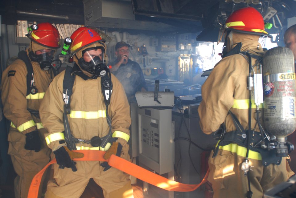 US Navy 111101-N-DU438-194 Sailors enter the pilothouse to investigate the space during a fire drill