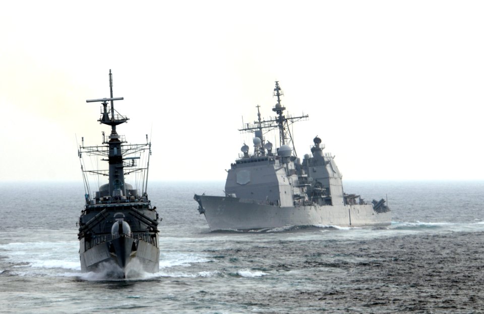 US Navy 111102-N-XQ375-412 The Pakistani navy destroyer PNS Shahjahan (D 186), left, and the guided-missile cruiser USS Mobile Bay (CG 53) transit