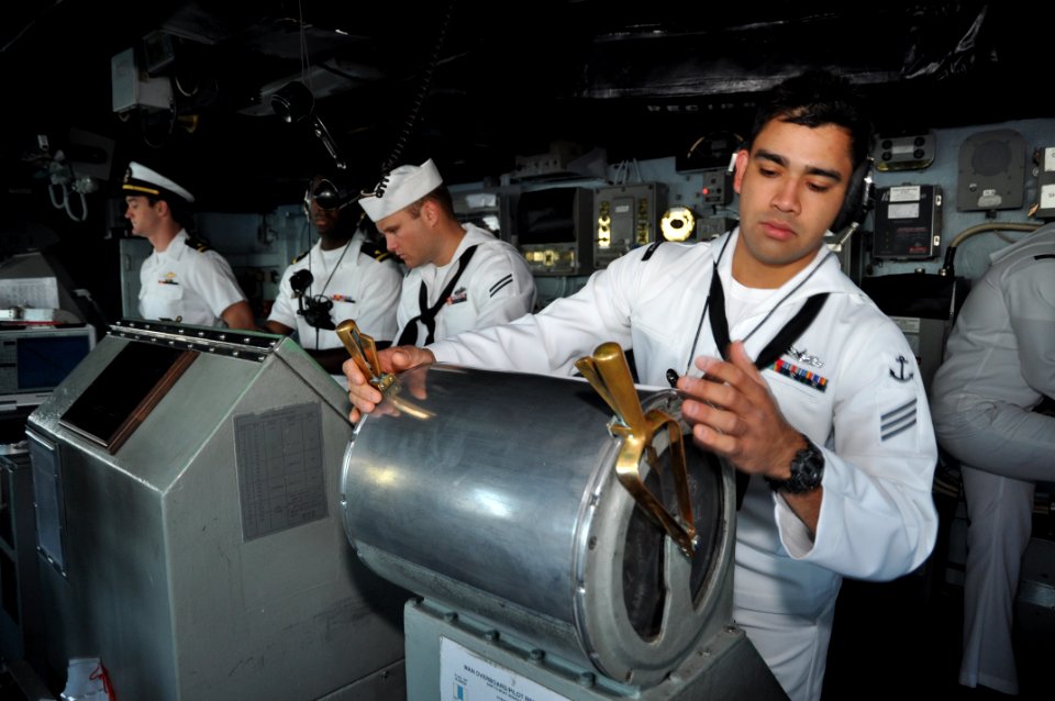 US Navy 111101-N-YX169-007 Seaman Apprentice Nicholas Flores stands watch at the lee helm aboard the amphibious transport dock ship USS Ponce (LPD