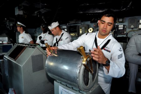 US Navy 111101-N-YX169-007 Seaman Apprentice Nicholas Flores stands watch at the lee helm aboard the amphibious transport dock ship USS Ponce (LPD