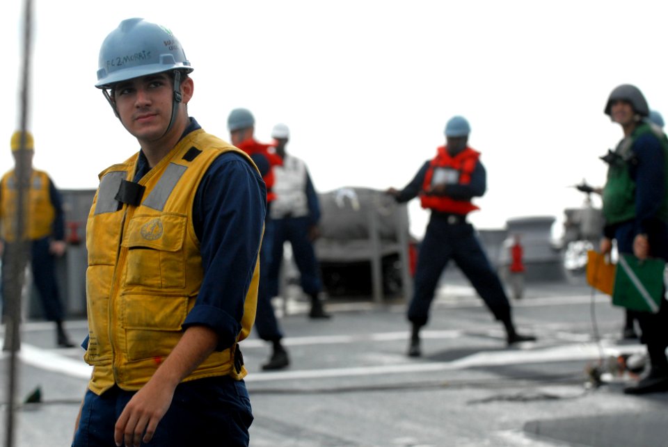 US Navy 111107-N-WW409-062 Fire Controlman 2nd Class Joshua Morris prepares for a replenishment at sea with the Military Sealift Command fleet repl