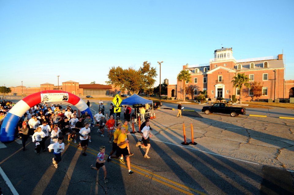 US Navy 111105-N-GS507-392 More than 800 runners and walkers start the first-ever Tyler Jefferson Memorial 5K Run in front of the Center for Inform
