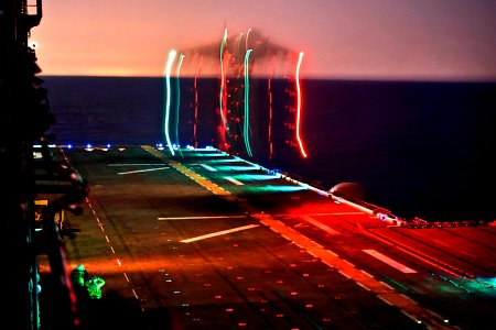 US Navy 111107-N-ZC343-258 A Marine Corps Harrier AV-8B II conducts nighttime launch and recovery operations